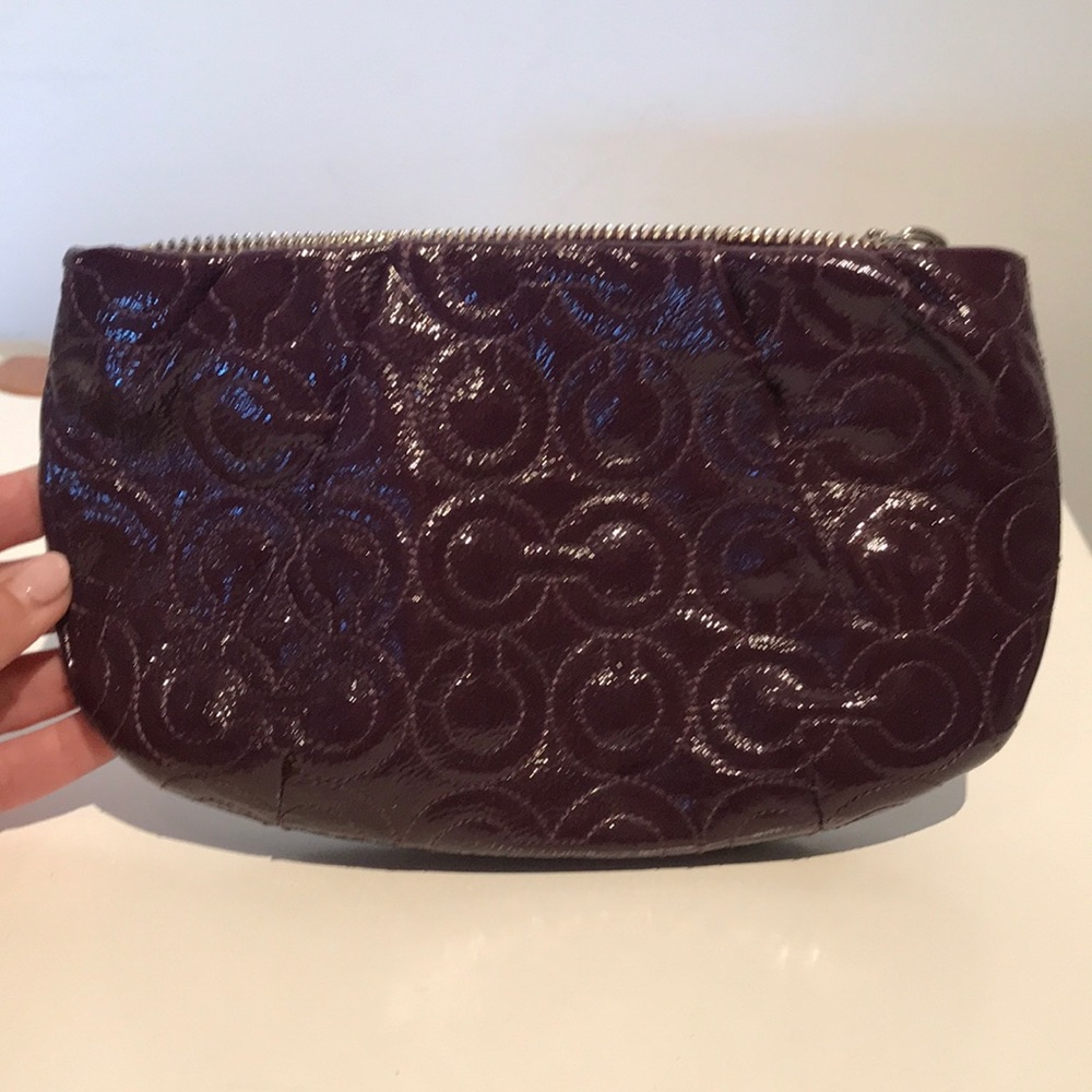 Purple patent leather Coach clutch